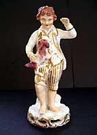 A RARE REGENCY ENGLISH PORCELAIN FIGURE OF A BOY AND DOG BLOOR DERBY MARK C.1825