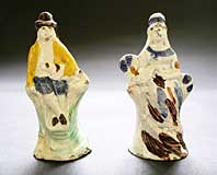 A PAIR OF EARLY STAFFORDSHIRE POTTERY PRATTWARE TOY FIGURES THE FARMER AND WIFE C.1795-1815
